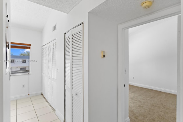 6445 SW 130th Pl Unit 612, Miami, FL 33183 - corridor with a textured ceiling and vaulted ceiling