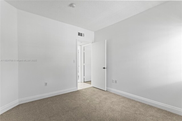 6445 SW 130th Pl Unit 612, Miami, FL 33183 - empty room featuring light colored carpet, a smoke detector, and a textured ceiling