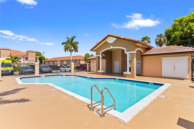 6445 SW 130th Pl Unit 612, Miami, FL 33183 - community pool featuring a patio area and a residential view
