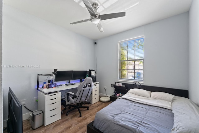 18739 SW 28th St, Miramar, FL 33029 - bedroom with wood finished floors, a ceiling fan, and a desk
