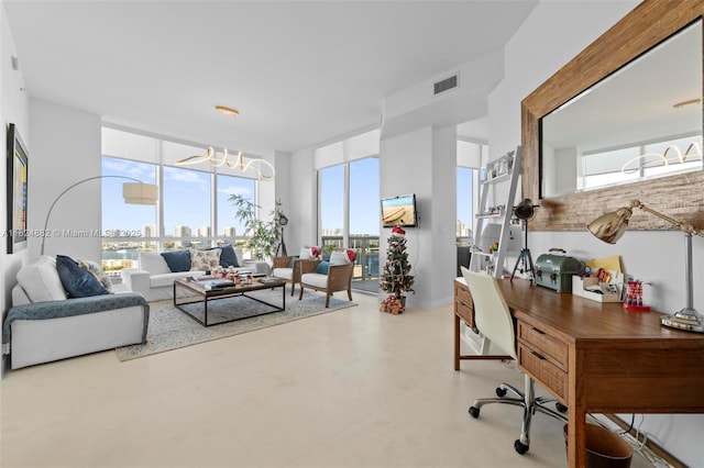 18201 Collins Ave Unit 201A, Sunny Isles Beach, FL 33160 - living room with a chandelier, an office area, and concrete flooring