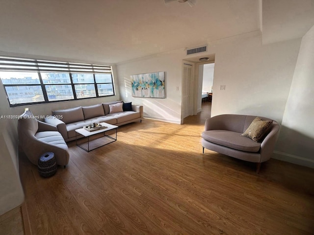 10000 Bay Harbor Ter Unit 502-A, Bay Harbor Islands, FL 33154 - living room with wood finished floors and baseboards