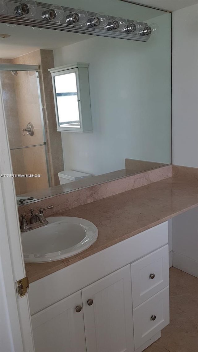 10000 Bay Harbor Ter Unit 502-A, Bay Harbor Islands, FL 33154 - full bathroom with vanity, tile patterned flooring, and a shower with door