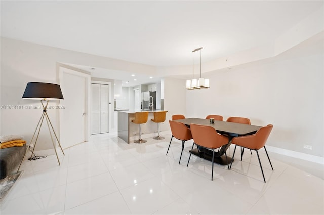 701 Brickell Key Blvd Unit 1605, Miami, FL 33131 - dining space featuring light tile patterned floors, recessed lighting, and a chandelier