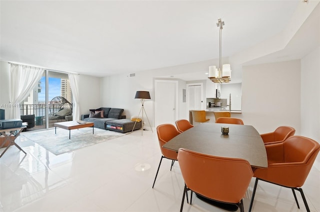 701 Brickell Key Blvd Unit 1605, Miami, FL 33131 - dining area with light tile patterned floors