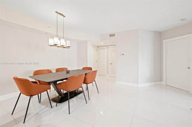 701 Brickell Key Blvd Unit 1605, Miami, FL 33131 - dining room featuring baseboards and light tile patterned floors