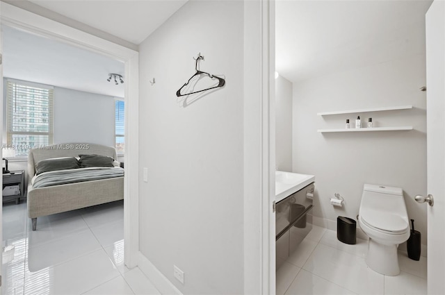 701 Brickell Key Blvd Unit 1605, Miami, FL 33131 - ensuite bathroom featuring toilet and tile patterned flooring