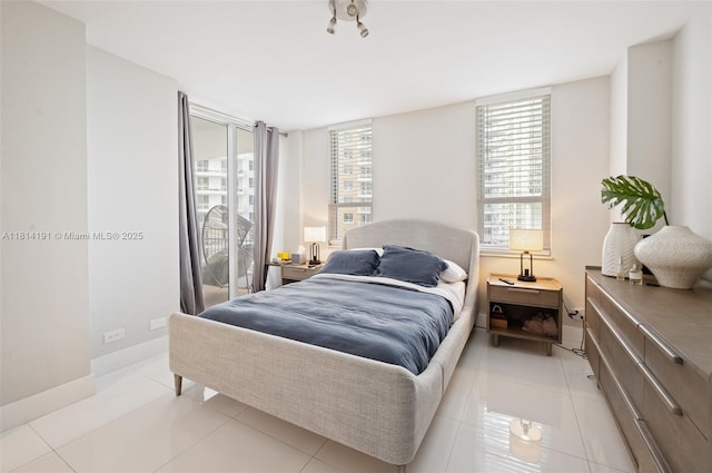 701 Brickell Key Blvd Unit 1605, Miami, FL 33131 - bedroom featuring light tile patterned floors and access to outside