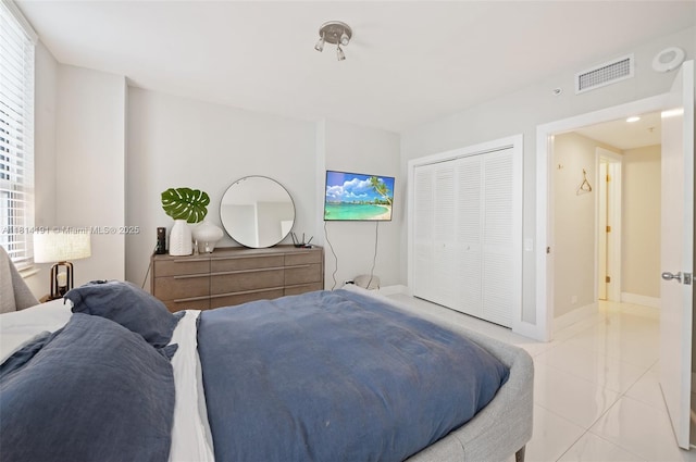 701 Brickell Key Blvd Unit 1605, Miami, FL 33131 - bedroom with light tile patterned flooring and a closet