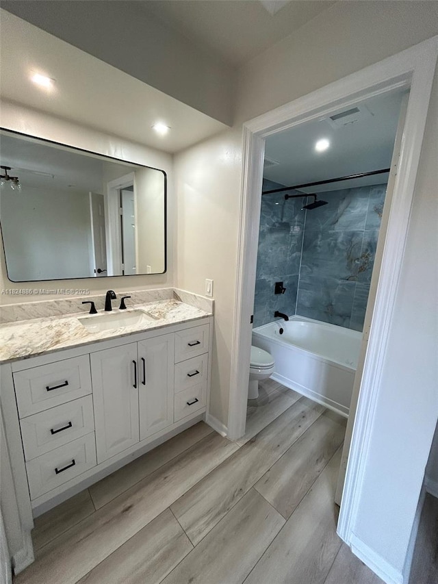 2921 NE 185th St Unit 1205, Aventura, FL 33180 - full bath featuring wood finished floors, vanity, washtub / shower combination, and recessed lighting