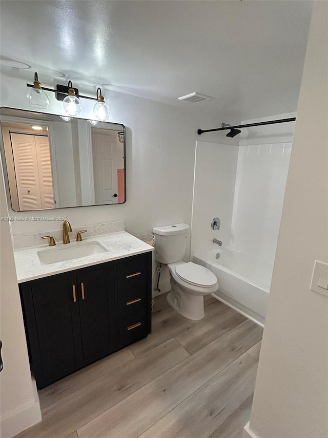 2921 NE 185th St Unit 1205, Aventura, FL 33180 - full bathroom featuring wood finished floors, vanity, and shower / tub combination