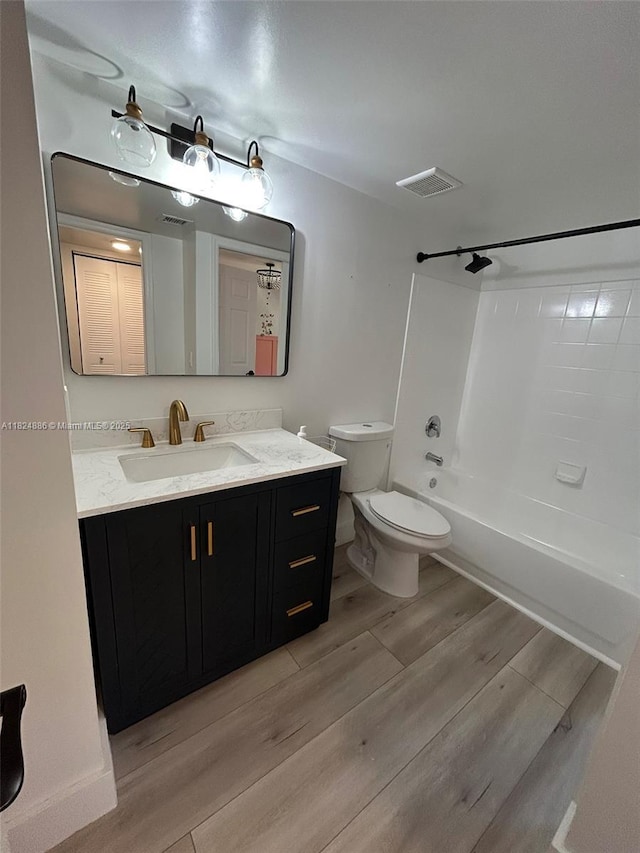 2921 NE 185th St Unit 1205, Aventura, FL 33180 - bathroom featuring wood finished floors, vanity, and bathing tub / shower combination