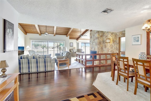 1600 SW 72nd Ave, Plantation, FL 33317 - dining area with beamed ceiling, wood finished floors, a textured ceiling, and a chandelier