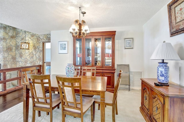 1600 SW 72nd Ave, Plantation, FL 33317 - dining room featuring a textured ceiling, a chandelier, and light carpet