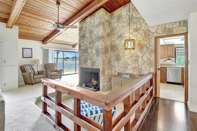 1600 SW 72nd Ave, Plantation, FL 33317 - living room with ceiling fan, a fireplace, wood ceiling, a water view, and wood finished floors