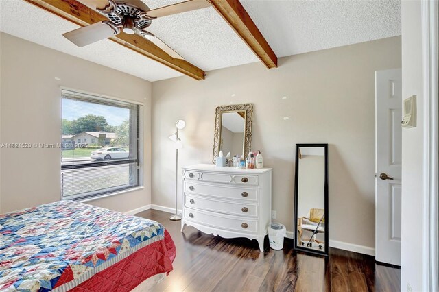 1600 SW 72nd Ave, Plantation, FL 33317 - bedroom featuring beamed ceiling, wood finished floors, a textured ceiling, and ceiling fan