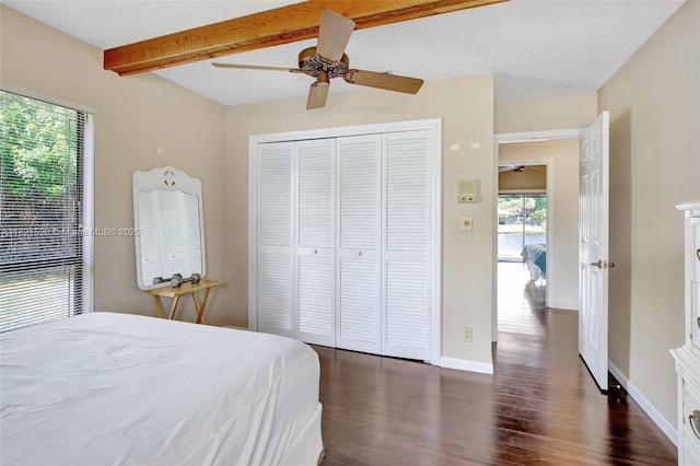 1600 SW 72nd Ave, Plantation, FL 33317 - bedroom featuring beamed ceiling, dark wood-type flooring, a closet, and a ceiling fan