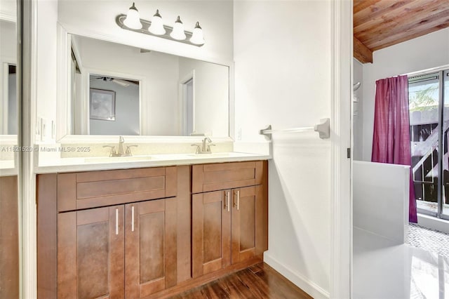 1600 SW 72nd Ave, Plantation, FL 33317 - bathroom featuring wooden ceiling, double vanity, and wood finished floors