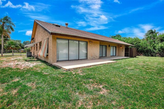 1600 SW 72nd Ave, Plantation, FL 33317 - back of property with a patio area and stucco siding