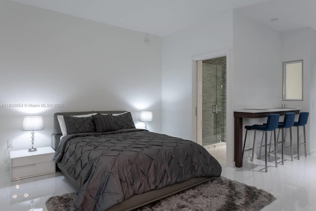 851 NE 1st Ave Unit 503, Miami, FL 33132 - bedroom with tile patterned floors and connected bathroom