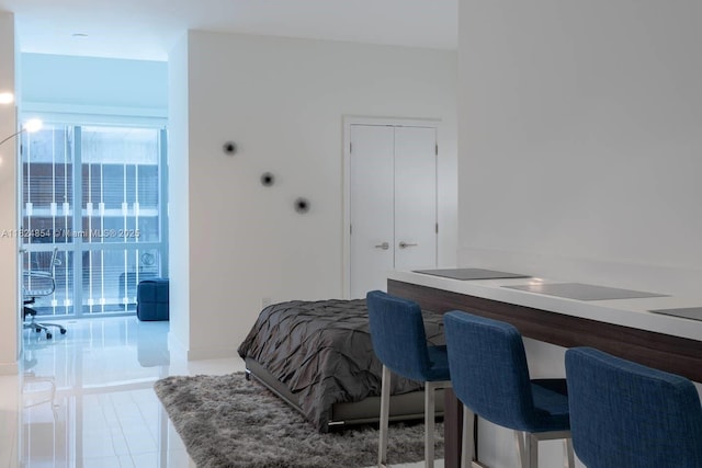 851 NE 1st Ave Unit 503, Miami, FL 33132 - bedroom featuring tile patterned flooring and a closet