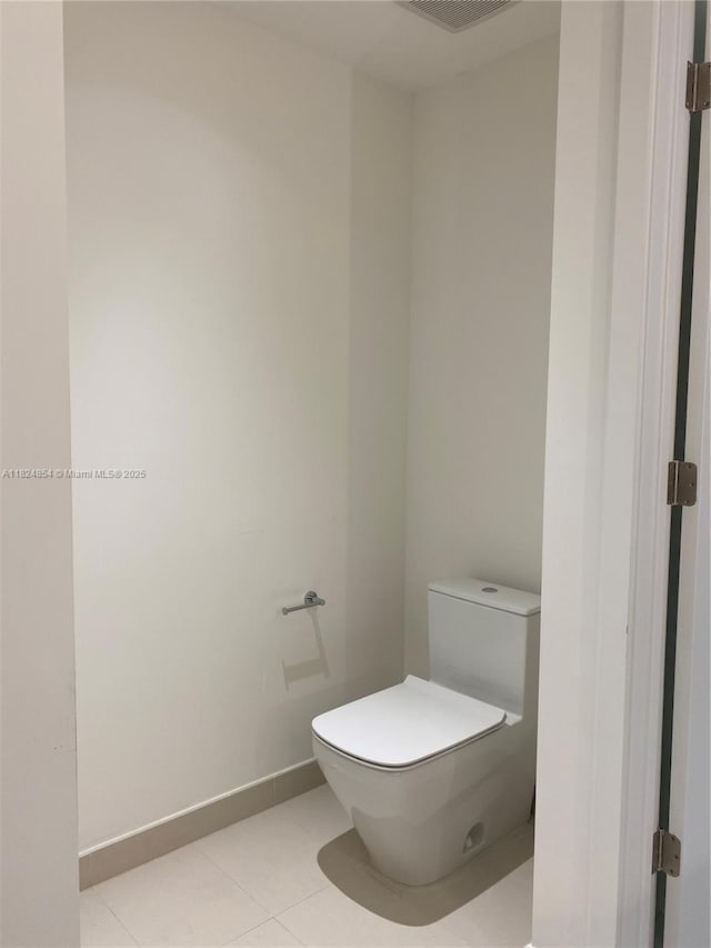 851 NE 1st Ave Unit 503, Miami, FL 33132 - bathroom with toilet and tile patterned floors