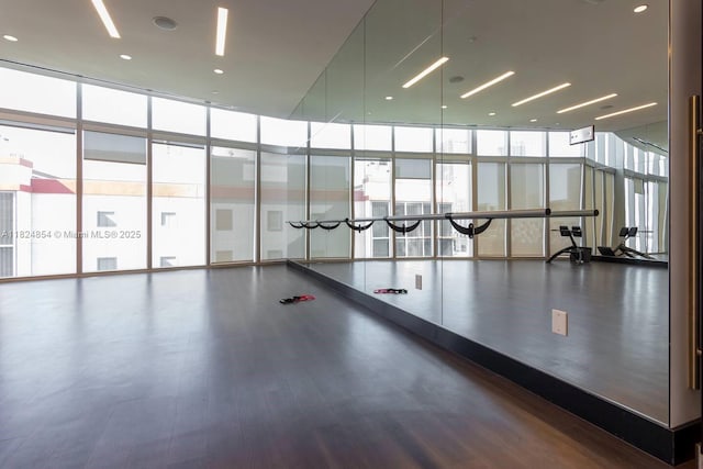 851 NE 1st Ave Unit 503, Miami, FL 33132 - workout area featuring floor to ceiling windows and wood finished floors