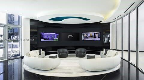 851 NE 1st Ave Unit 503, Miami, FL 33132 - home theater with plenty of natural light and tile patterned floors
