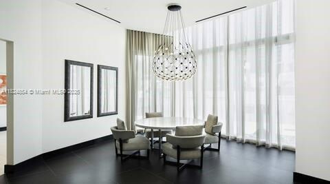851 NE 1st Ave Unit 503, Miami, FL 33132 - dining area featuring plenty of natural light and a chandelier