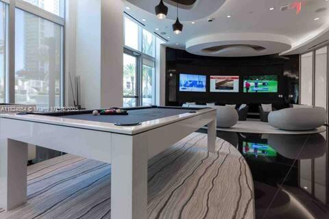 851 NE 1st Ave Unit 503, Miami, FL 33132 - game room with healthy amount of natural light and billiards