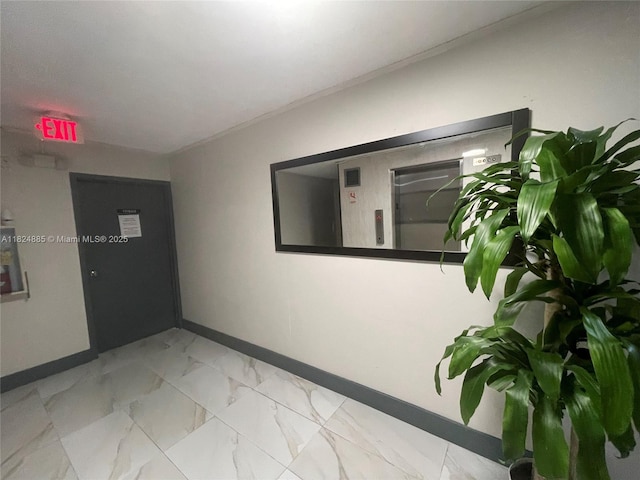 1250 NE 125th St Unit 410C, North Miami, FL 33161 - hallway featuring baseboards and marble look tiles