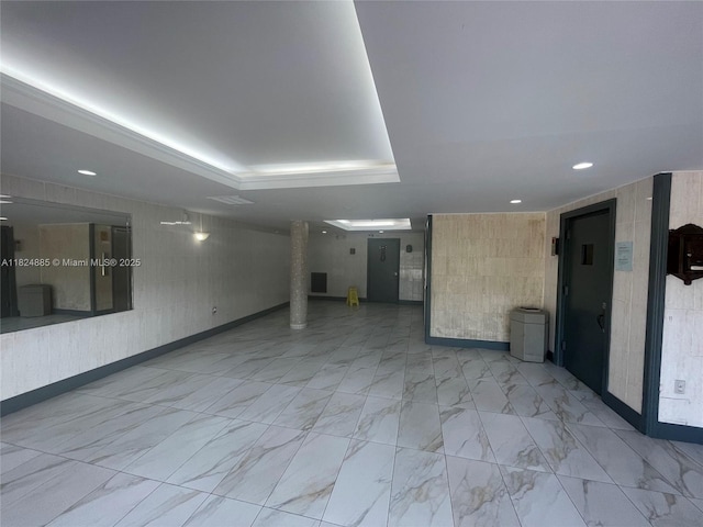 1250 NE 125th St Unit 410C, North Miami, FL 33161 - spare room featuring a tray ceiling, marble finish flooring, and recessed lighting