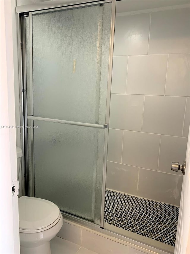 1250 NE 125th St Unit 410C, North Miami, FL 33161 - full bath featuring a stall shower and tile patterned flooring