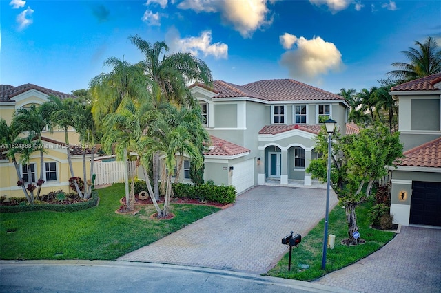 3610 SW 167th Ter, Miramar, FL 33027 - mediterranean / spanish-style house with decorative driveway, a tiled roof, and stucco siding