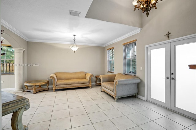 3610 SW 167th Ter, Miramar, FL 33027 - living area featuring ornamental molding, healthy amount of natural light, light tile patterned floors, decorative columns, and french doors