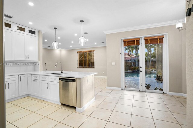 3610 SW 167th Ter, Miramar, FL 33027 - kitchen featuring dishwasher, crown molding, a peninsula, light countertops, and light tile patterned flooring