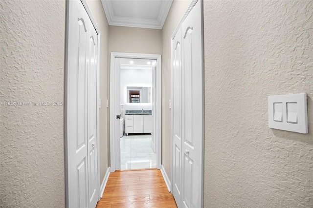 3610 SW 167th Ter, Miramar, FL 33027 - hall featuring a textured wall, crown molding, and light wood-style flooring