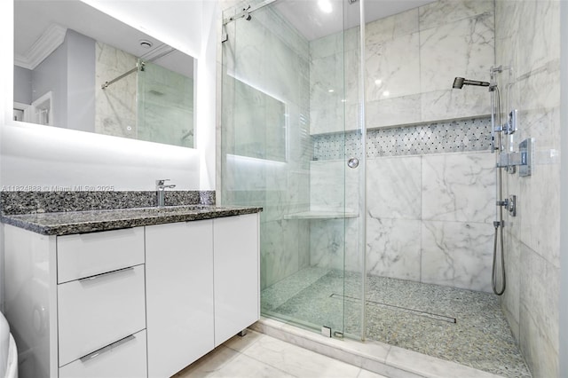 3610 SW 167th Ter, Miramar, FL 33027 - bathroom featuring a stall shower, vanity, marble look tiles, and ornamental molding