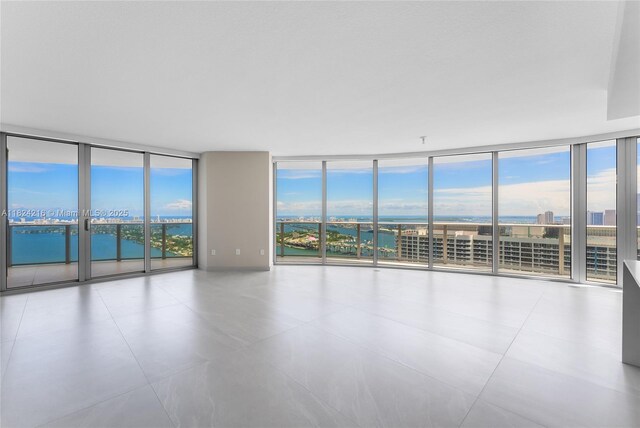 488 NE 18th St Unit 4112, Miami, FL 33132 - spare room with floor to ceiling windows and a water view