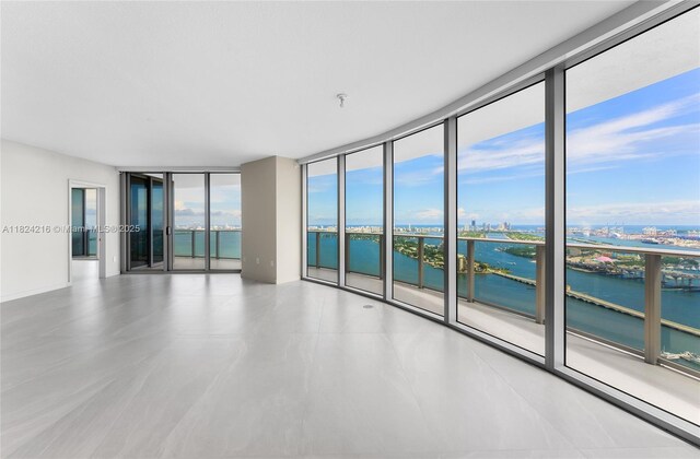 488 NE 18th St Unit 4112, Miami, FL 33132 - empty room with a water view, floor to ceiling windows, and fire sprinkler in ceiling