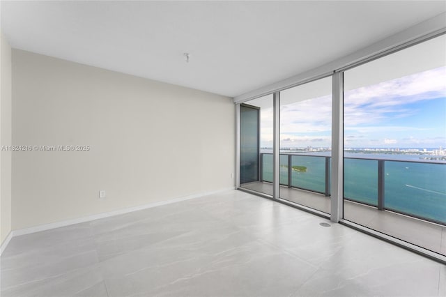 488 NE 18th St Unit 4112, Miami, FL 33132 - empty room with floor to ceiling windows and a water view