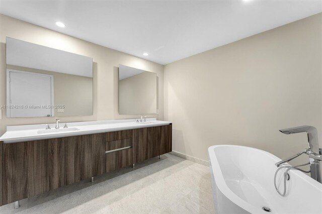 488 NE 18th St Unit 4112, Miami, FL 33132 - full bathroom featuring double vanity, a soaking tub, and recessed lighting