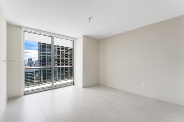 488 NE 18th St Unit 4112, Miami, FL 33132 - unfurnished room with a city view and expansive windows