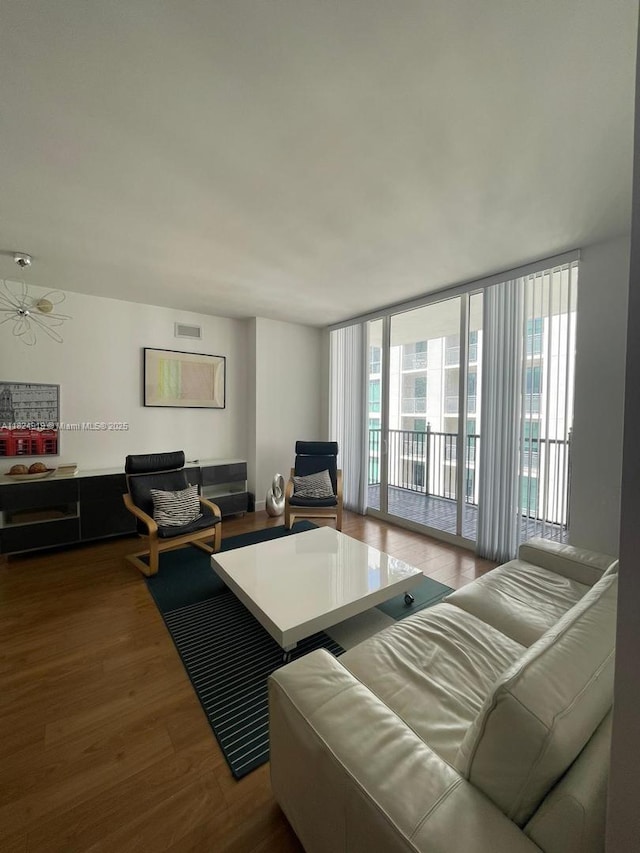 4100 Salzedo St Unit 809, Coral Gables, FL 33146 - living room with wood finished floors and a wall of windows