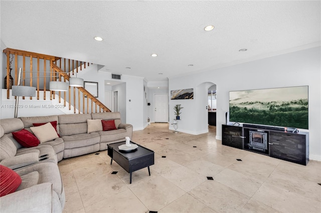 20709 NW 1st St, Pembroke Pines, FL 33029 - living area featuring stairway, ornamental molding, recessed lighting, a textured ceiling, and arched walkways