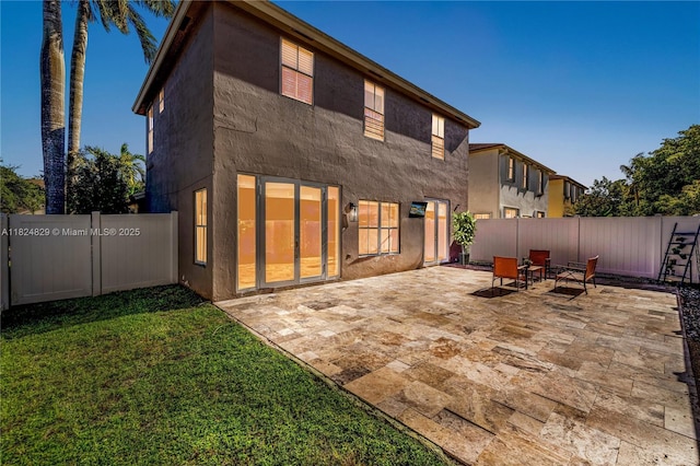 20709 NW 1st St, Pembroke Pines, FL 33029 - back of property with stucco siding, a patio area, and a fenced backyard