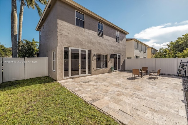 20709 NW 1st St, Pembroke Pines, FL 33029 - back of property with stucco siding, a fenced backyard, and a patio area