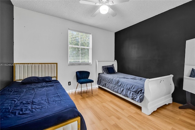 20709 NW 1st St, Pembroke Pines, FL 33029 - bedroom featuring wood finished floors, a textured ceiling, and ceiling fan