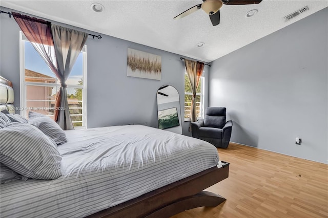 20709 NW 1st St, Pembroke Pines, FL 33029 - bedroom featuring a textured ceiling, wood finished floors, and a ceiling fan