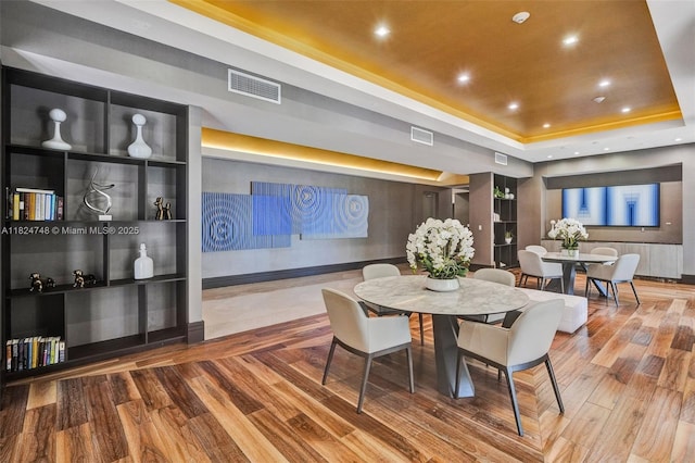 718 Valencia Ave Unit 204, Coral Gables, FL 33134 - dining area with a tray ceiling, wood finished floors, and recessed lighting